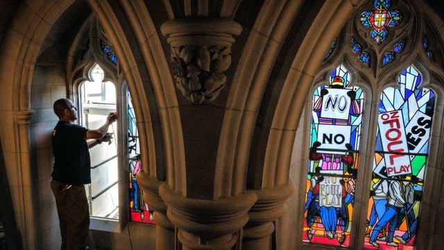 The National Cathedral installs stained glass windows dedicated to racial justice to replace the original confederate themed display on August 22 in Washington, DC. 